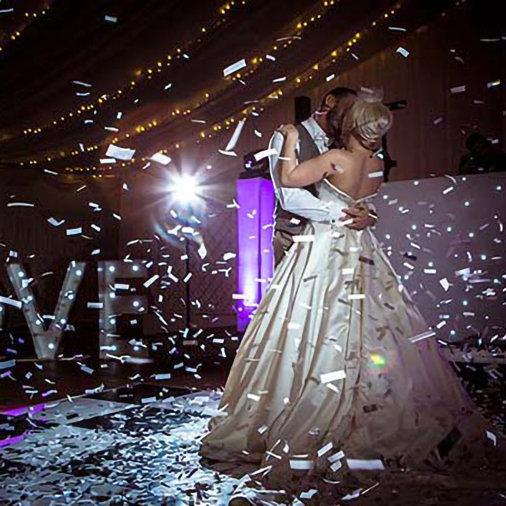 Confetti machine rental with marquee letters for a wedding