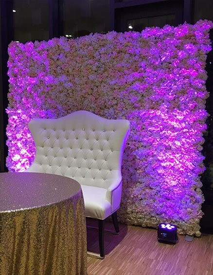 flower wall rental with uplighting